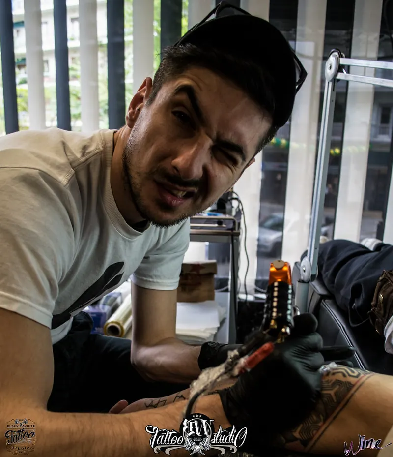 Tattoo artist at his station