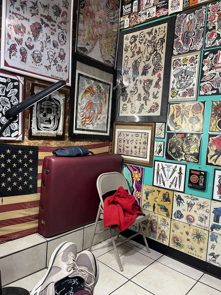Tattoo studio with flash on the walls