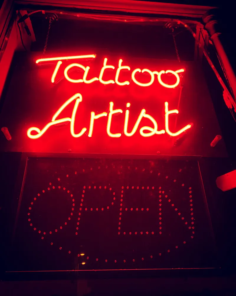 Neon tattoo artist sign